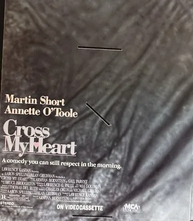 Actual Cross My Heart — MCA Home Video promo folder front photograph